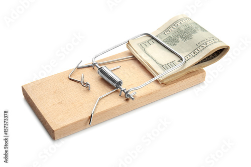 Pile of banknotes in mouse trap on white background. Concept of money bait