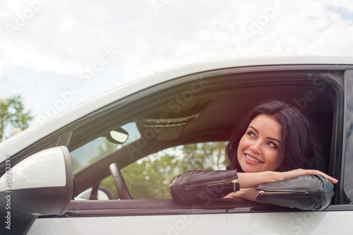 Young Woman Sitting Inside Car Smiling © demphoto