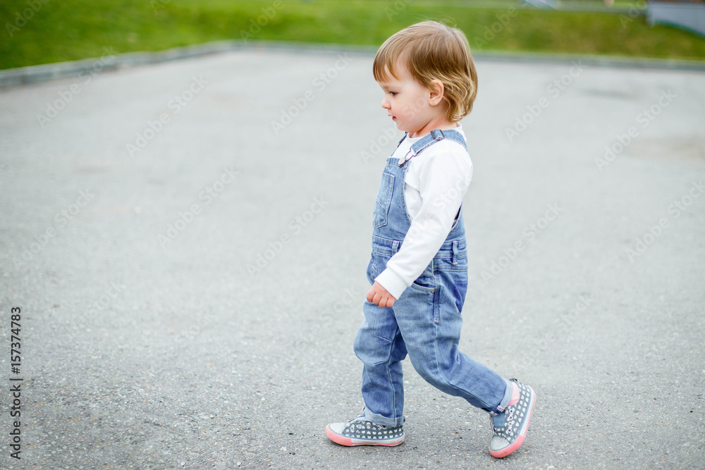 A small child on a walk in the city