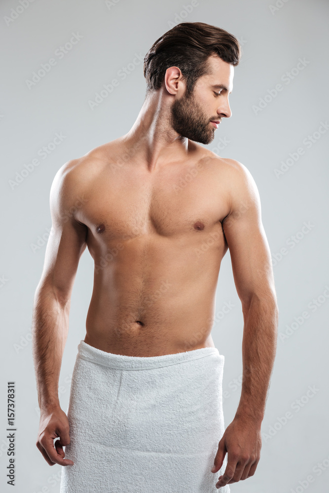 Handsome young man dressed in towel Handsome young man dressed in towel