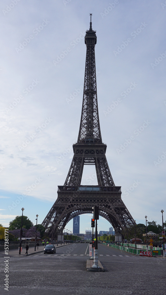 Fototapeta premium Photo of Eiffel Tower on a spring cloudy morning, Paris, France