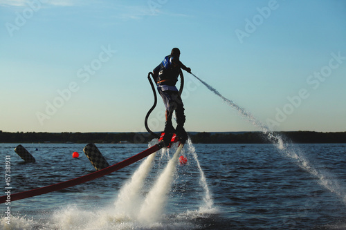 Man flying over water on flyboard photo