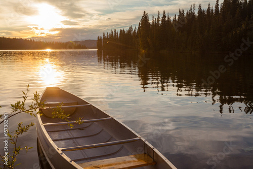 Fototapeta Naklejka Na Ścianę i Meble -  Frenchman Lake Yukon Canada canoe sunset scene