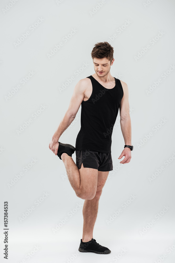 Portrait of a cheerful healthy man warming up before gym Portrait of a cheerful healthy man warming up before gym