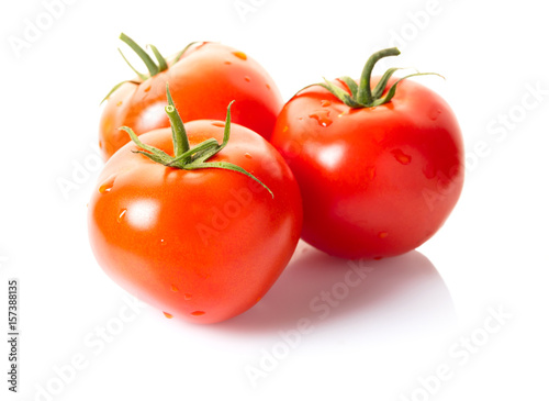 Ripe tomatoes with water drops