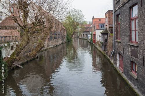 Beautiful view along of canal with old picturesque houses in historic part of Bruges (Brugge), Belgium