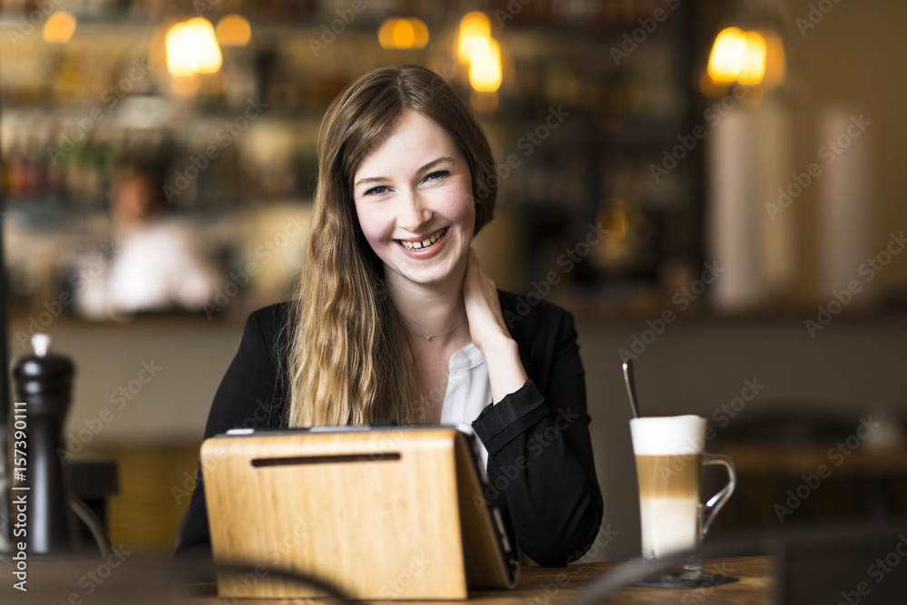 young business woman working at cafe at break
