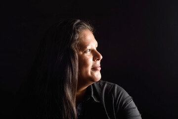 Portrait of a latin woman on black
