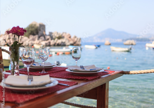 Served table in sea view restaurant 

