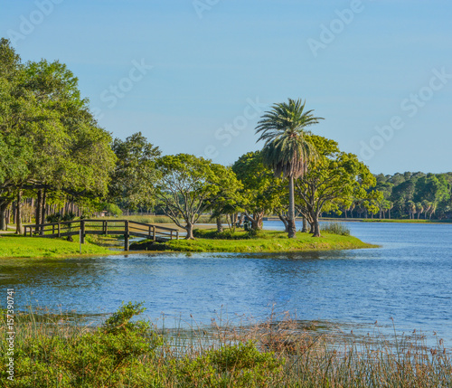 A beautiful day for a walk and the view of the wood bridge to the island at John S. Taylor Park in Largo, Florida. © Norm