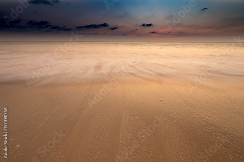 sunset in the sand on the beach