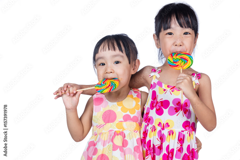 Asian Little Chinese girls eating lollipop