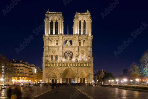 Notre Dame Cathedral with Paris cityscape at dusk