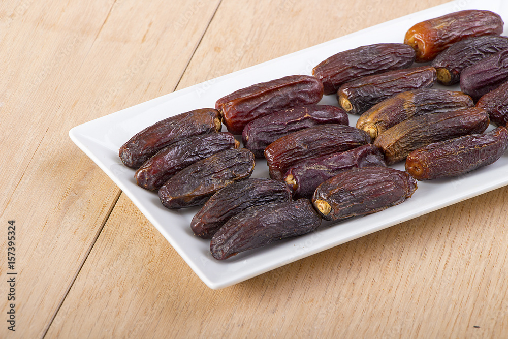 Dried dates in a white plate for iftar in Ramadan