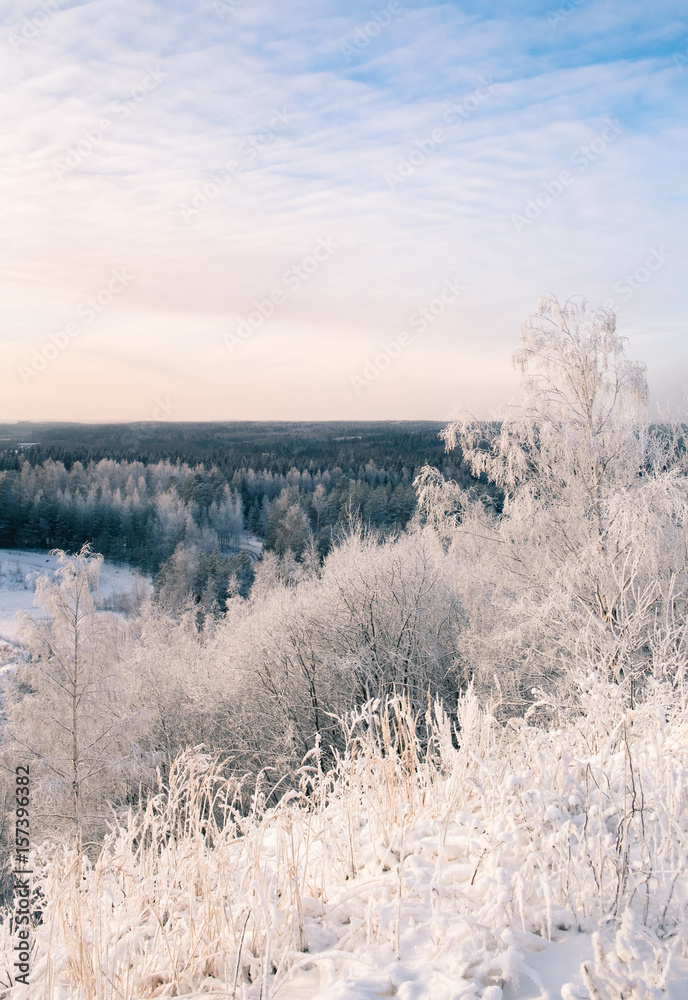Scenic landscape with sunset at winter time in Finland