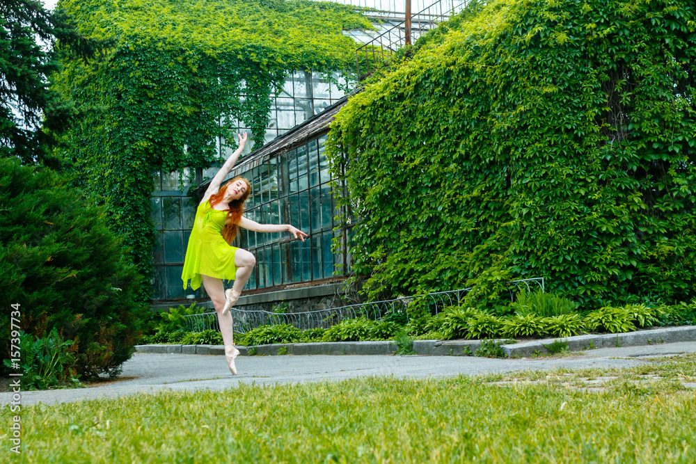 Fototapeta premium Dancing ballerina in the summer garden.