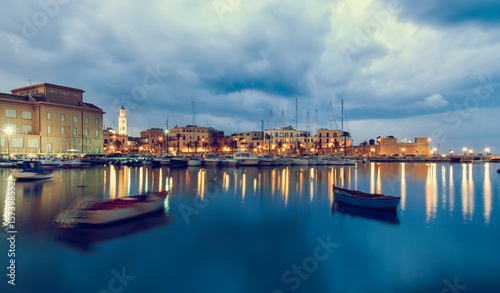 Bari seafront city view from marina. Blue sea and cloudy sky. Long exposure Filtered image photo