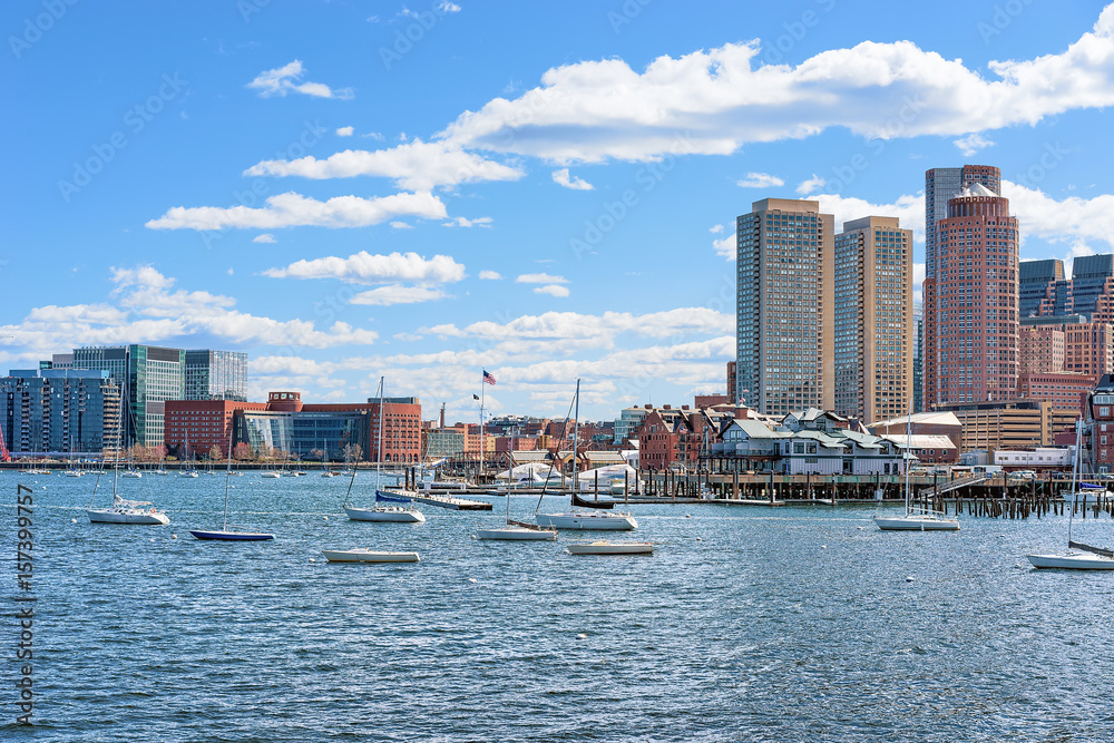 Floating boats with the skyline of Boston MA