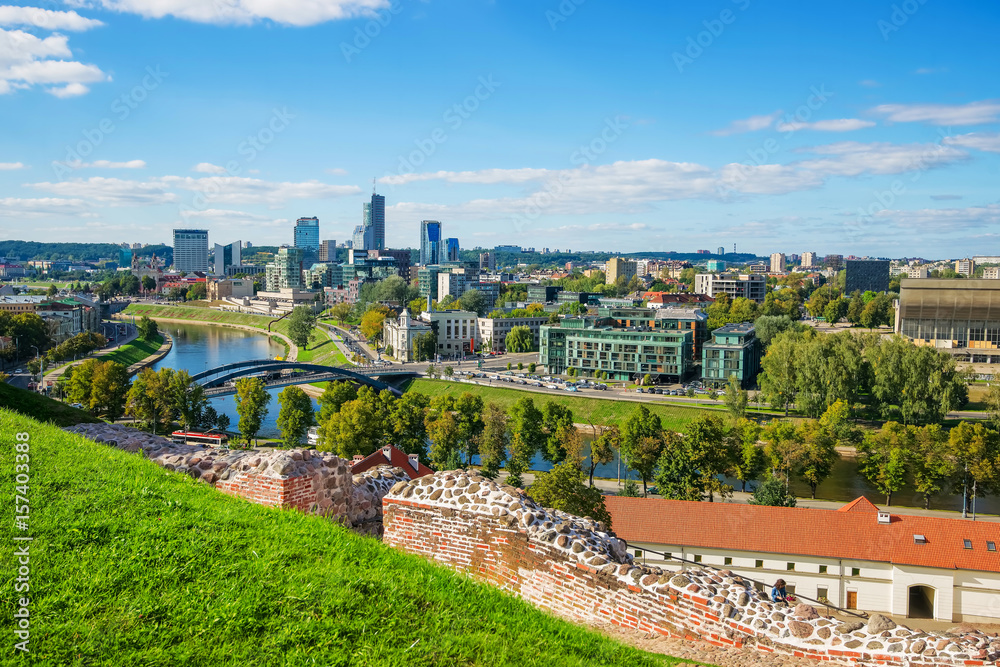 Wall ruins and Financial district with skyscrapers in Vilnius