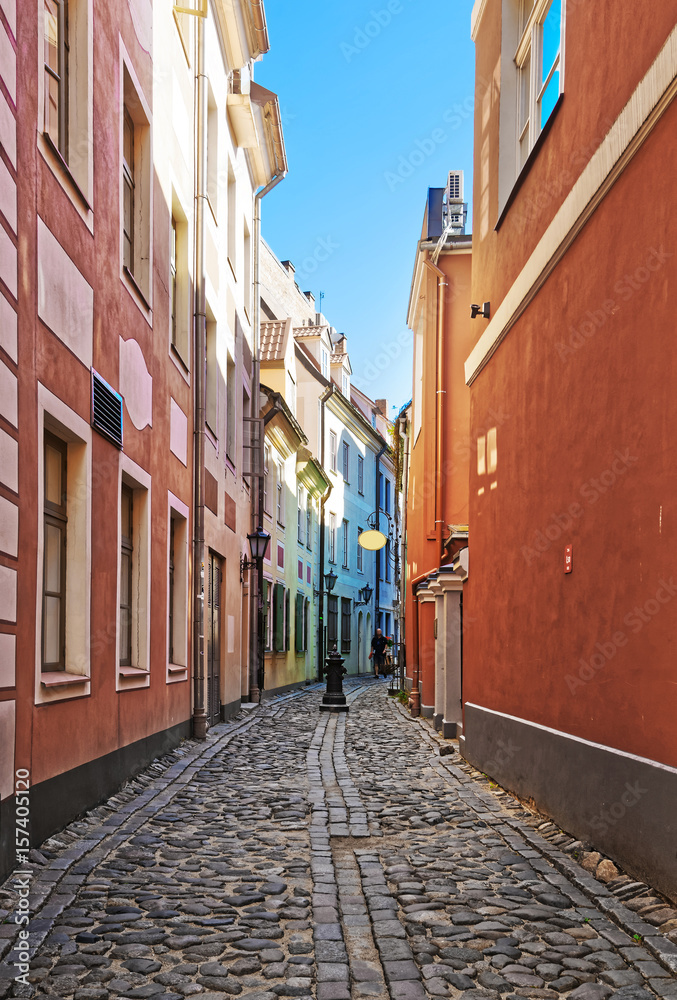 Narrow Street and people in historical center of Riga