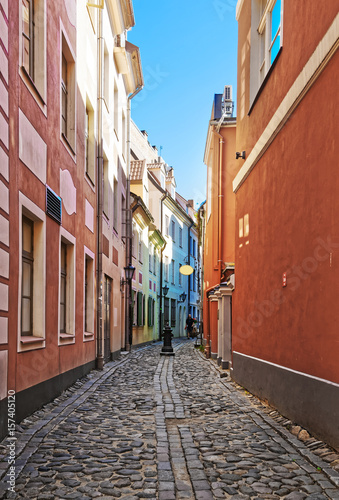 Narrow Street and people in historical center of Riga