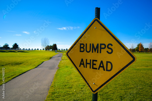 Bumps Ahead Sign Near Paved Path 