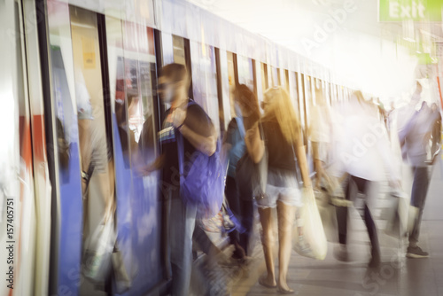 Blurred people getting in railroad station urban systems in most cities for background