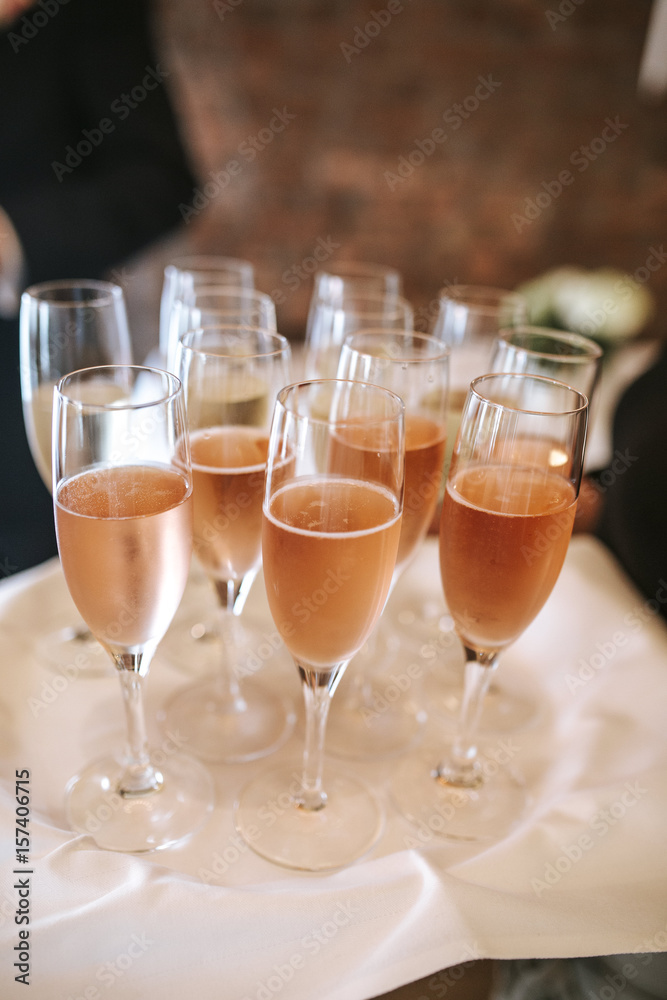 Sparkling wine served on the tray at the restaurant Sparkling wine served on the tray at the restaurant