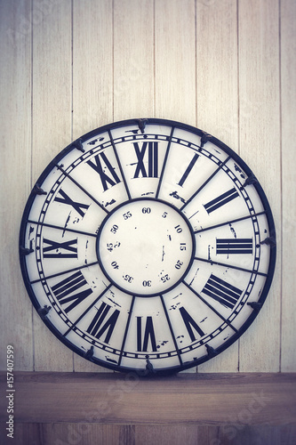 Vintage clock on the wood wall, Vintage color