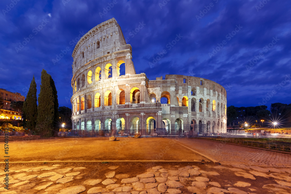 Colosseum or Coliseum at night, also known as the Flavian Amphitheatre, the largest amphitheatre ever built, in the centre of the old city of Rome, Italy.