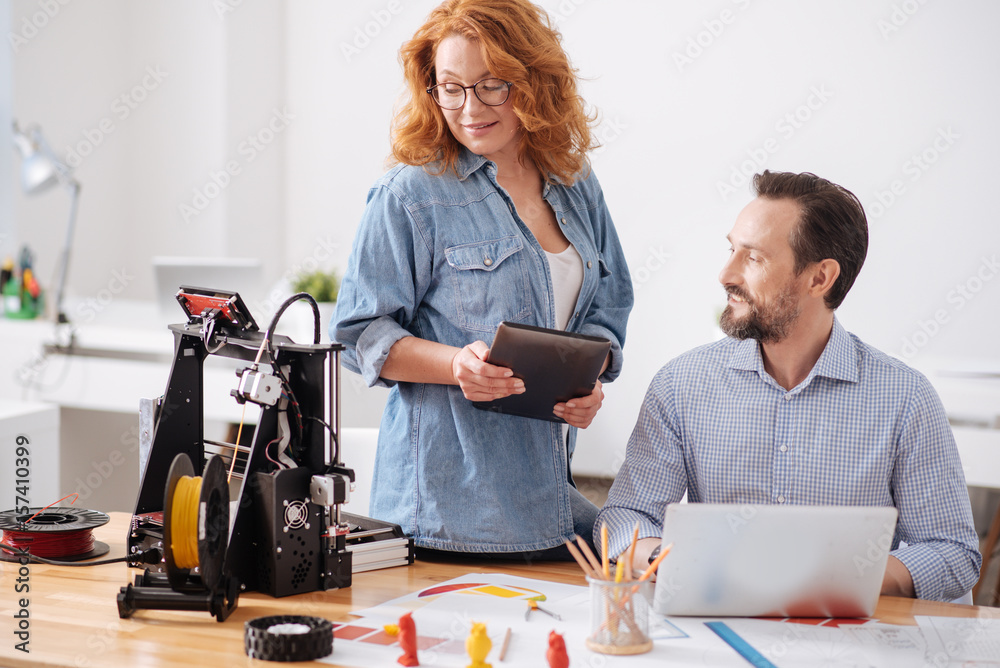 Professional female designer holding a tablet Professional female designer holding a tablet