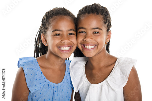 Two Adorable african twin girl on studio white background photo