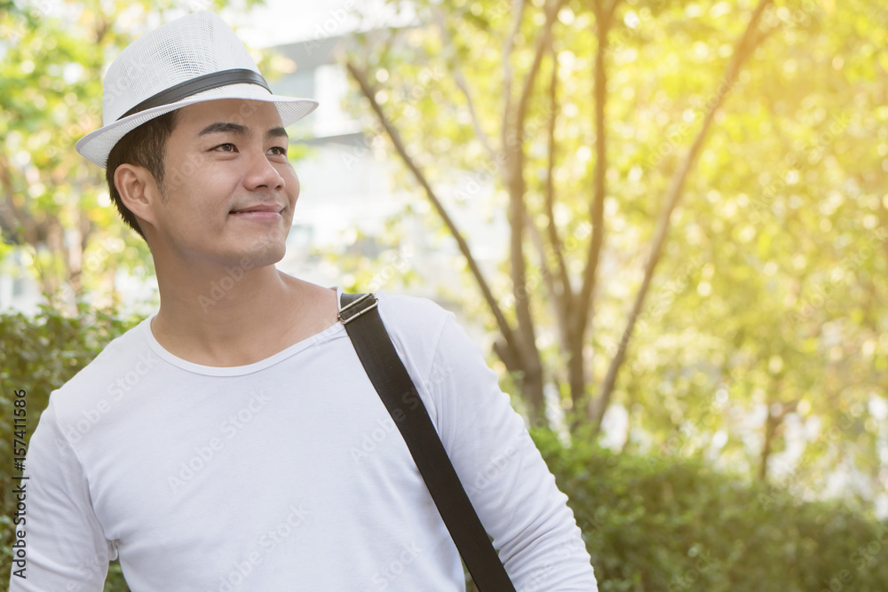 happy man traveller looking up, green city environment happy man traveller looking up, green city environment