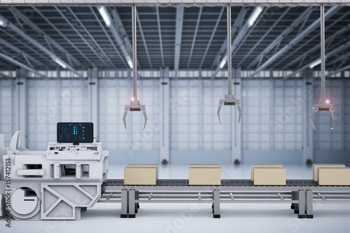 robot arms with boxes on conveyor in factory