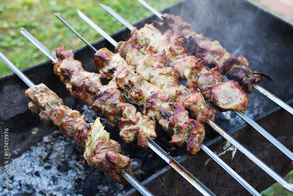 Fresh hot kebab skewers over charcoal. Selective focus