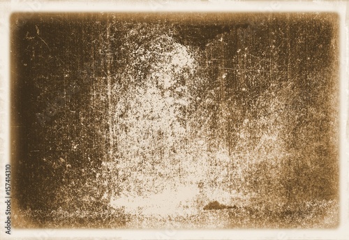 Retro sepia wall surface close up with faded borders for texture or background.