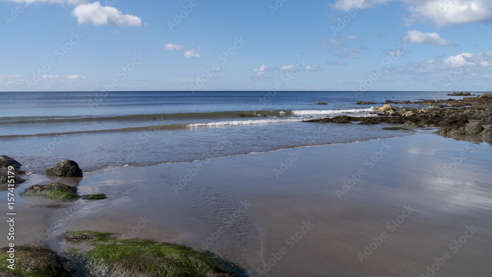 Calm sunny beach day in South Cornwall, UK