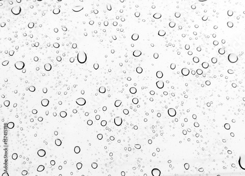 Raindrops water drop on window glass white background