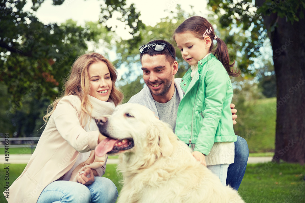 happy family with labrador retriever dog in park happy family with labrador retriever dog in park
