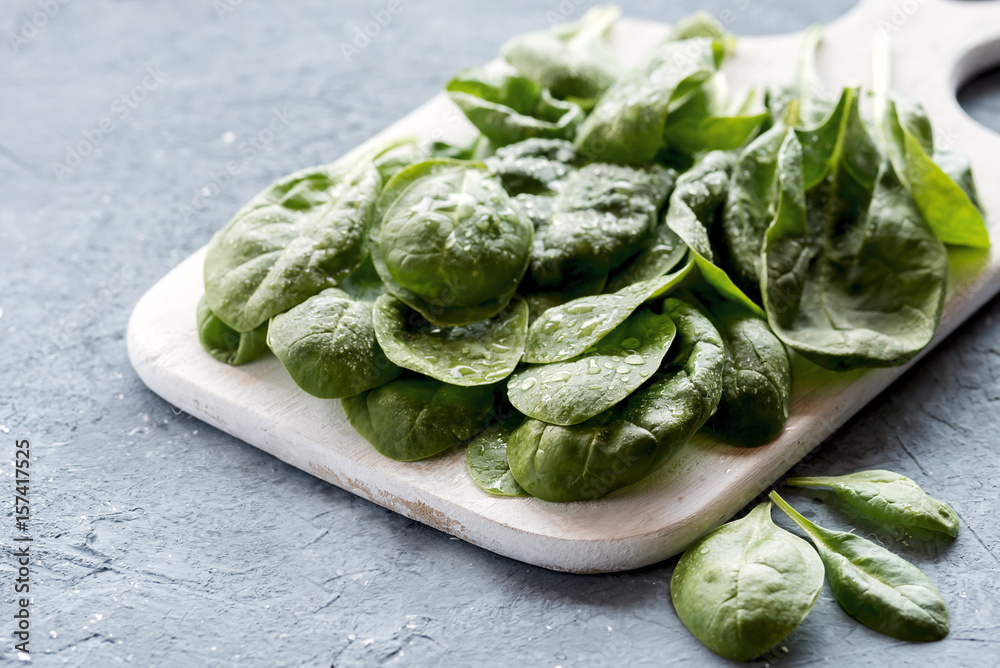 Fresh raw spinach on wooden board Healthy food Diet food Fresh raw spinach on wooden board Healthy food Diet food