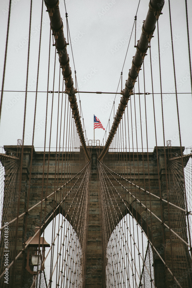 Fototapeta premium Brooklyn Bridge with American Flag