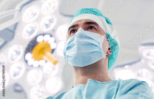 surgeon in operating room at hospital photo