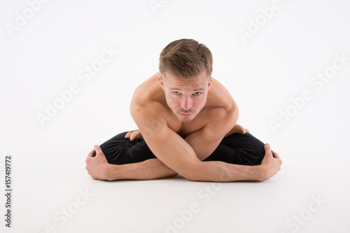 Yoga. The lotus position. Sexy man and a healthy lifestyle. Sport and strength. 