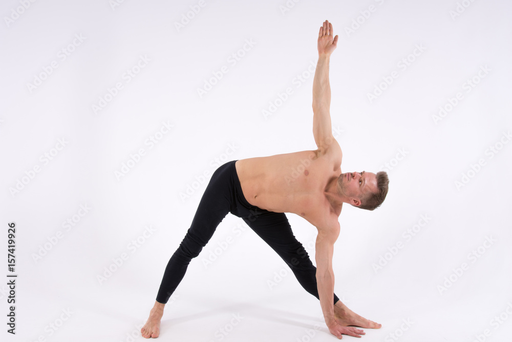 Yoga. Sexy man and a healthy lifestyle. Sport and strength. 