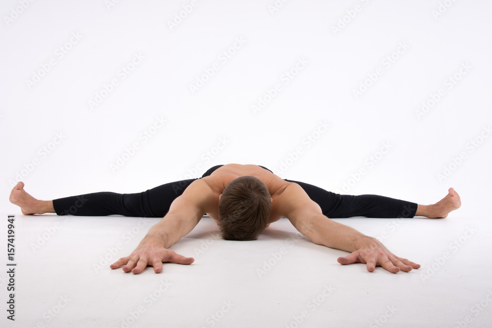Funny Yoga. Fitness and healthy lifestyle. Sexy man and a healthy  lifestyle. Sport and strength. Stock Photo | Adobe Stock