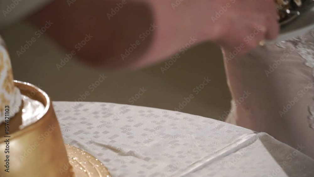 Bride takes two pieces of celebration cake closeup Bride takes two pieces of celebration cake closeup