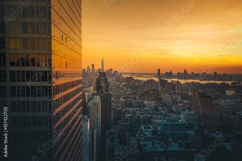 Freedom tower at sunset from a skyscraper photo