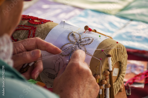 A woman makes bobbin lacing (Palickovanie) - Folk art