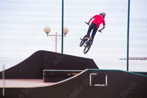 BMX bicycler over ramp