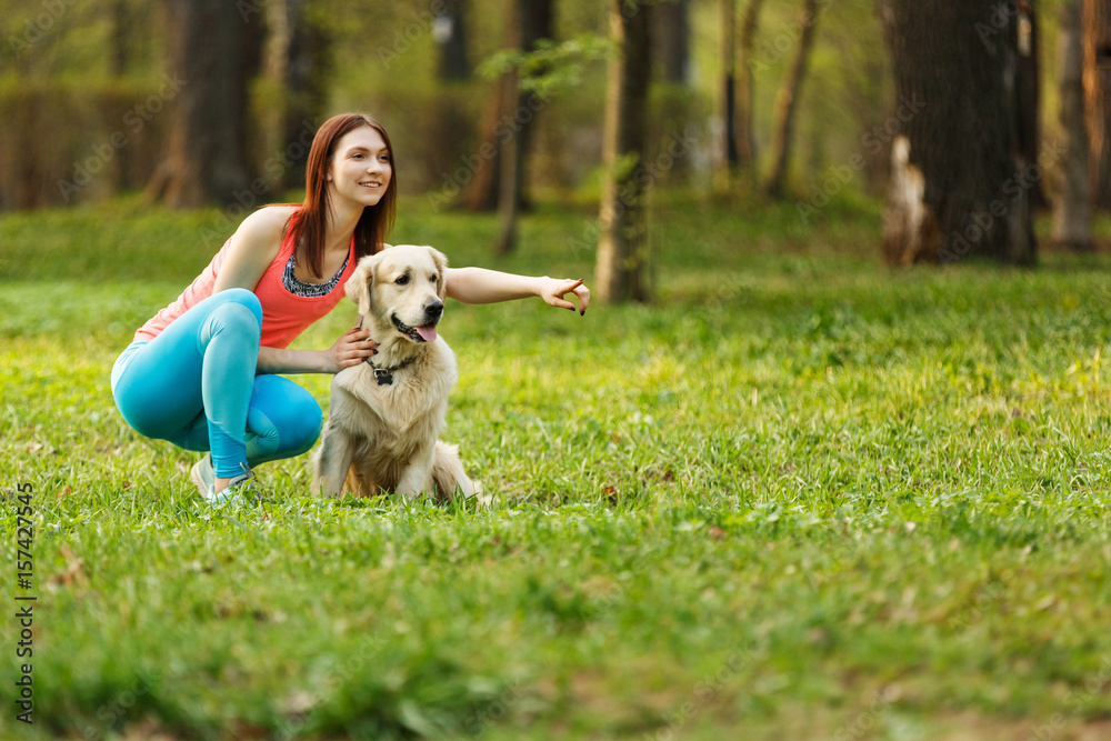 Girl shows something to dog Girl shows something to dog